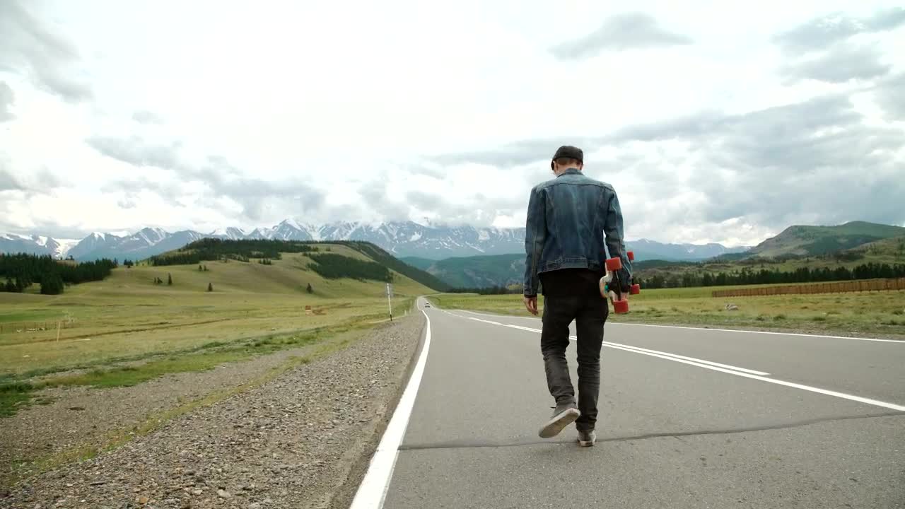 Download Stock Video Man On A Longboard On The Roa Animated Wallpaper