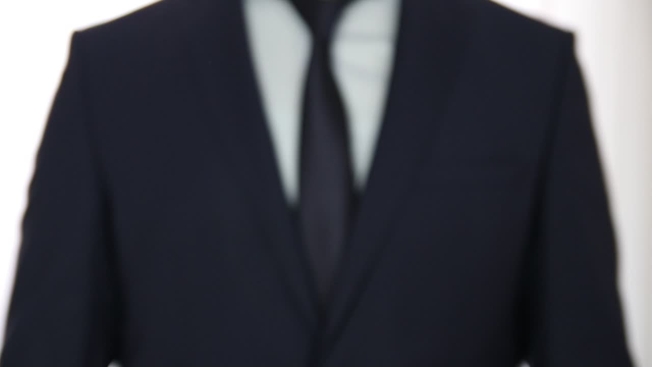 Download Stock Video Man In Suit Giving A Set Of Key Animated Wallpaper