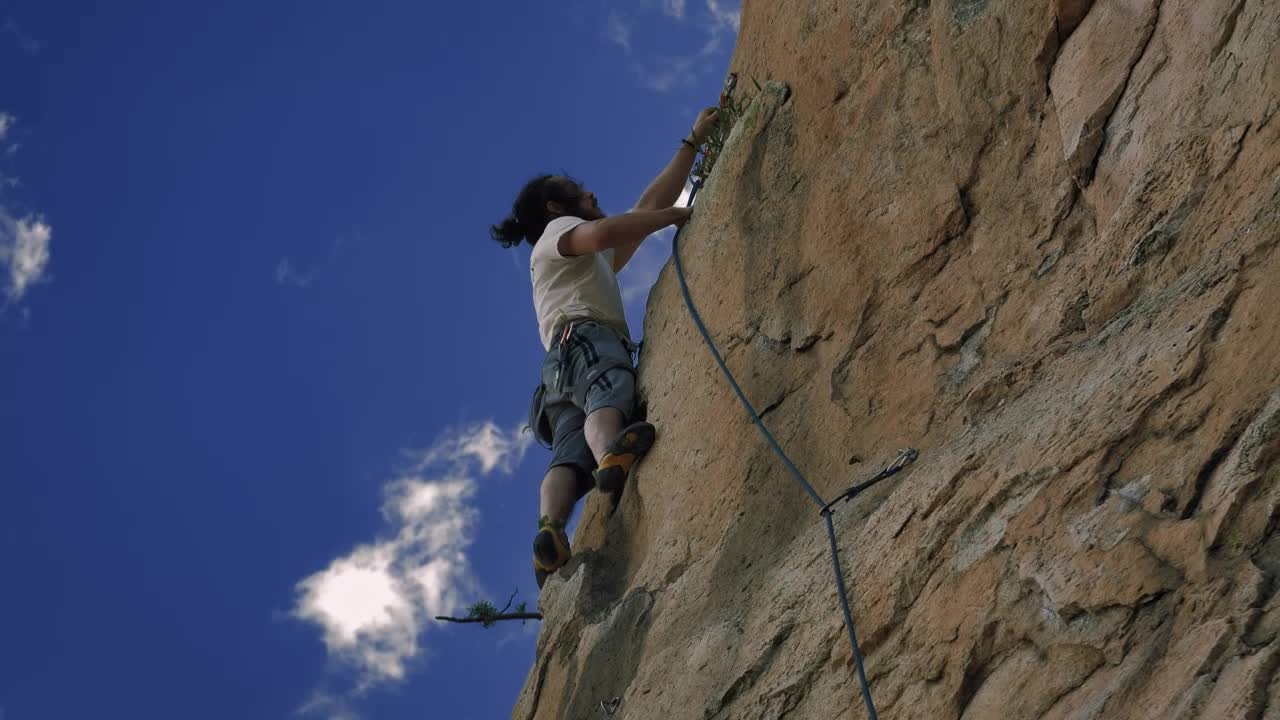 Download Stock Video Mountaineer Climbing On Top Of A Mountain Live Wallpaper