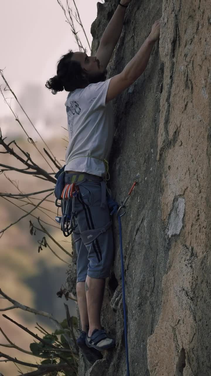 Download Stock Video Mountaineer Climbing A Rocky Vertical Mountain Live Wallpaper