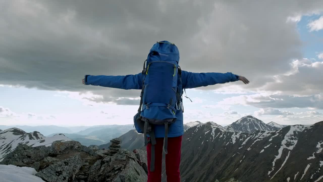 Download Stock Video Mountaineer Raising Hands On Top Of A Mountain Live Wallpaper