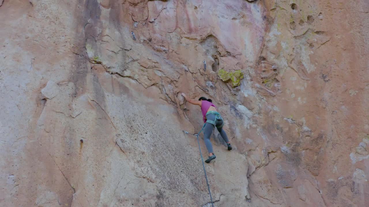 Download Stock Video Mountaineer Woman Climbing A Huge Mountain Live Wallpaper