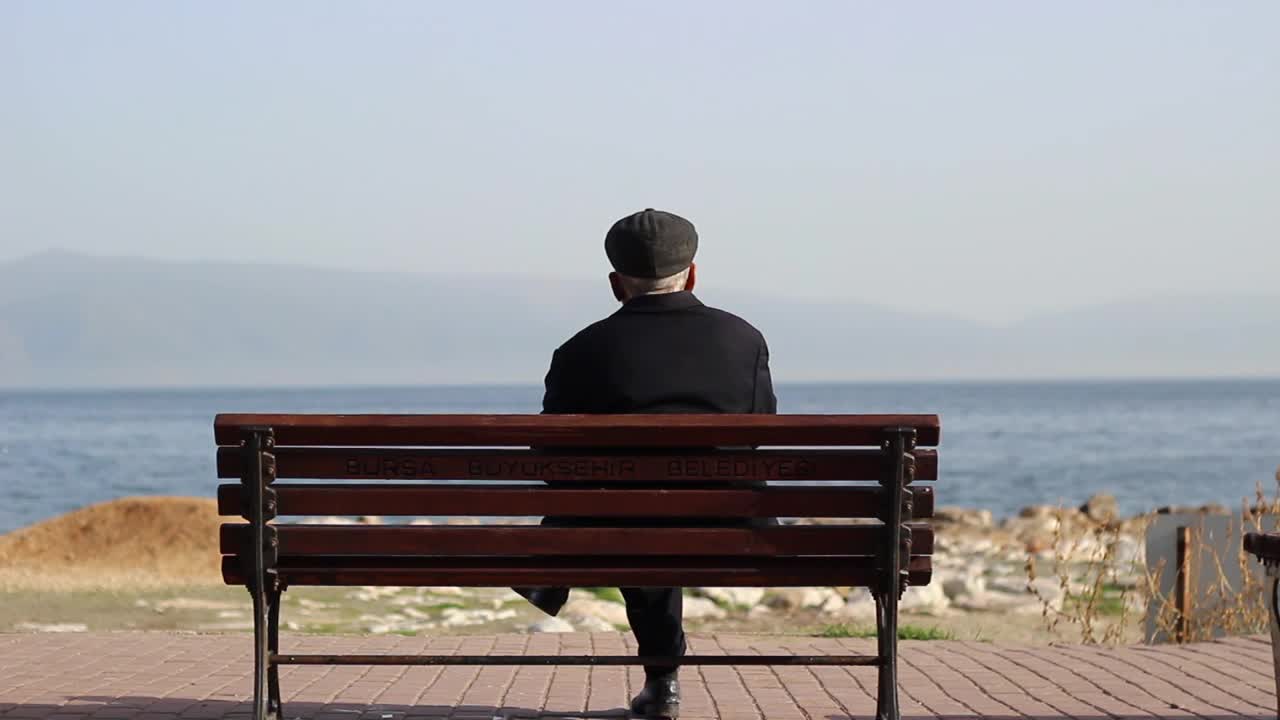 Download Stock Video Old Aged Man Relaxing In Front Of The Sea Live Wallpaper