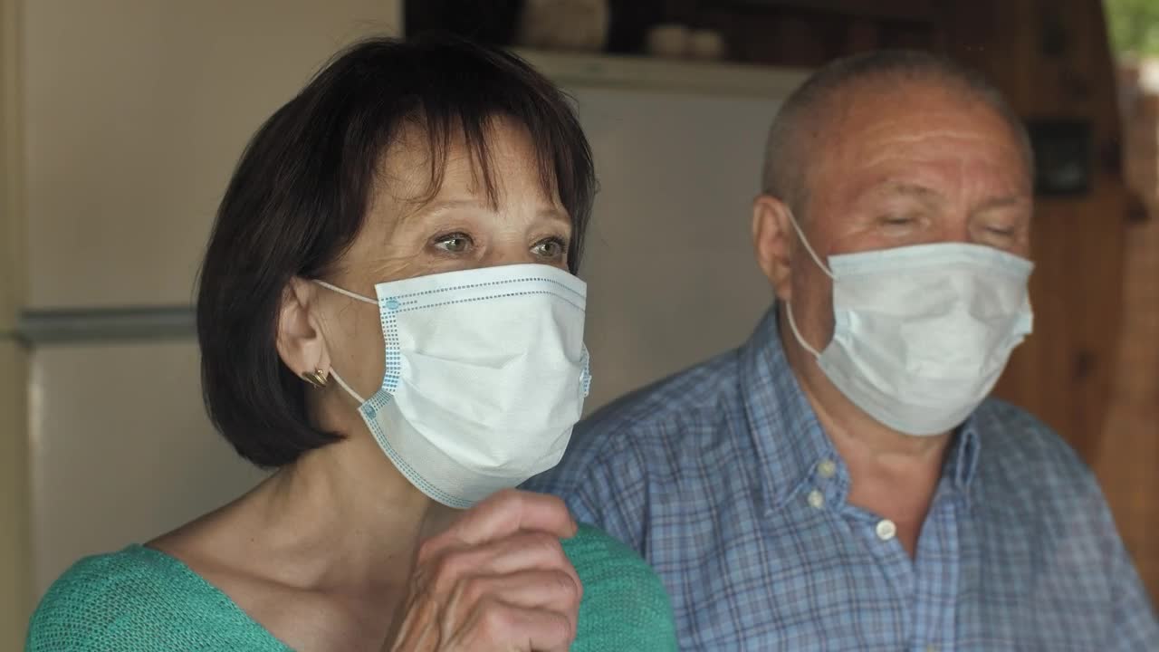 Download Stock Video Old Couple Taking Off Their Masks At Home Live Wallpaper