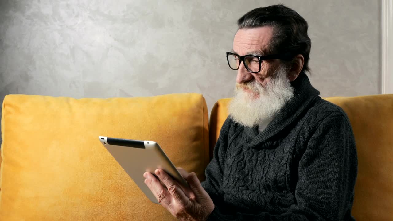 Download Stock Video Old Man Answers Mobile Phone Call While On Tablet At Live Wallpaper