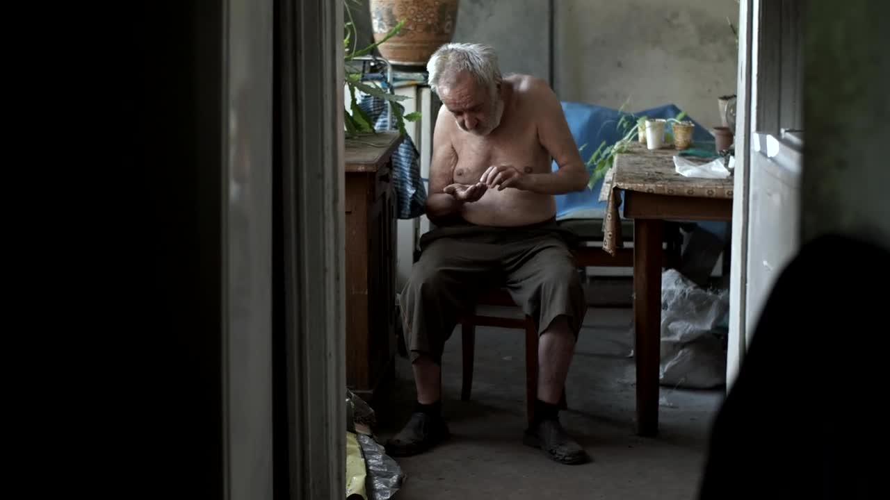 Download Stock Video Old Poor Hungry Man Counting Coins Live Wallpaper