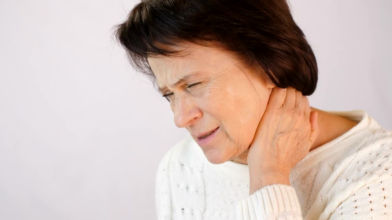 Download Stock Video Old Woman Sore Her Neck From Tension Live Wallpaper