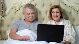 Download Stock Video Older Couple Chatting On A Laptop Live Wallpaper