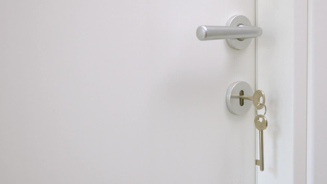 Download Stock Video Opening A Door With A Hanging Key Live Wallpaper