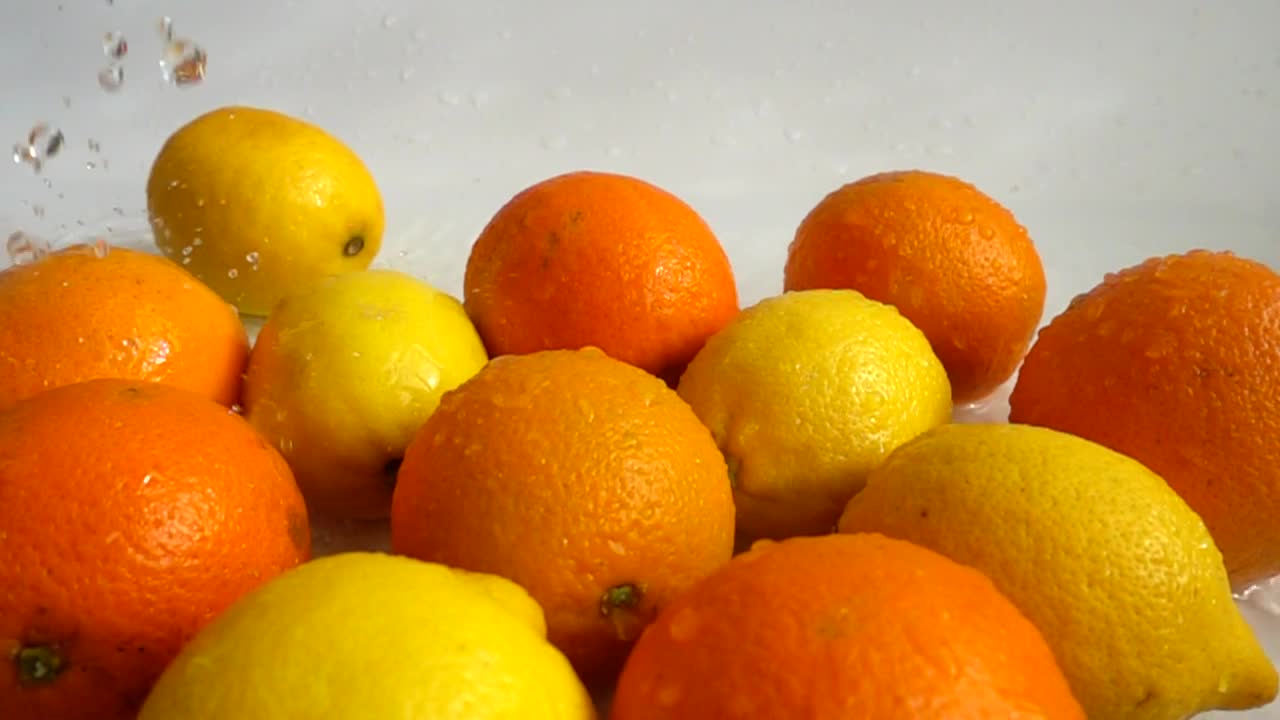 Download Stock Video Oranges And Lemons Being Wet Live Wallpaper