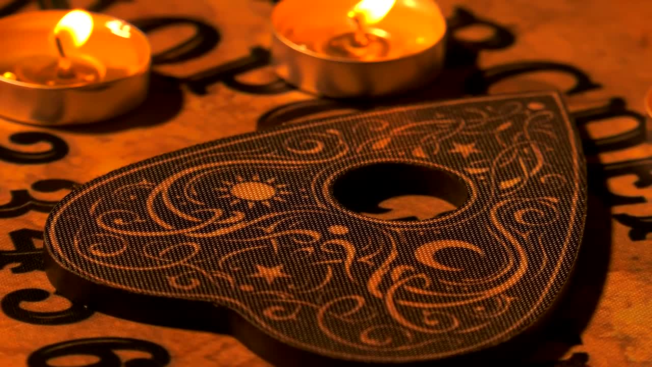 Download Stock Video Ouija Board With Candles On It Live Wallpaper