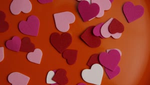 Download Stock Video Paper Shape Hearts On An Orange Surface Live Wallpaper