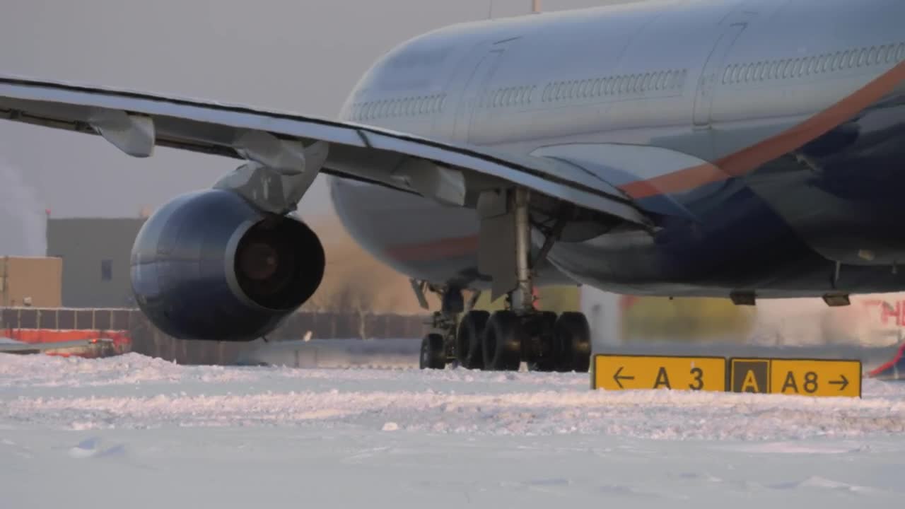 Download Stock Video Passenger Plane On A Snowy Runway Live Wallpaper