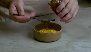 Download Stock Video Pastry Chef Adding Honey To A Mixture Live Wallpaper