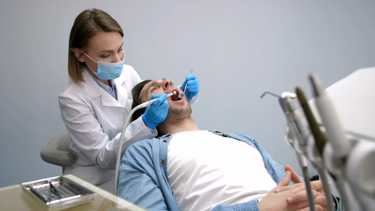 Download Stock Video Patient Having Their Teeth Cleaned Live Wallpaper