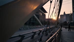 Download Stock Video Pedestrian Bridge In A City At Sunset Live Wallpaper