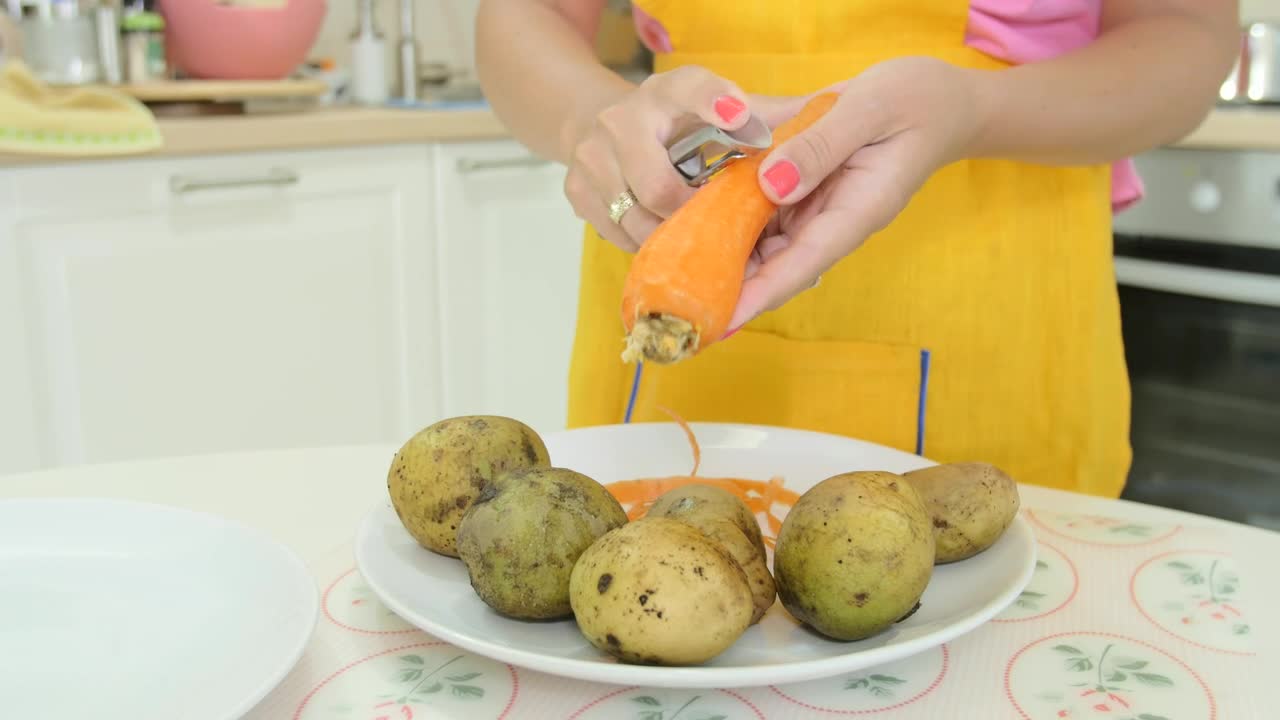 Download Stock Video Peeling A Carrot In The Kitchen Live Wallpaper