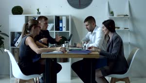 Download Stock Video People Having A Work Meeting Around A Table Live Wallpaper