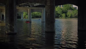 Download Stock Video People Rowing In A River Under A Large Bridge LargeLive Wallpaper