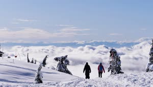 Download Stock Video People Walking On The Snowy Summit Live Wallpaper