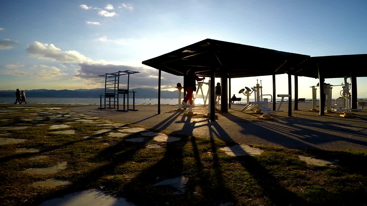 Download Stock Video People Working Out On The Beach At An Outdoor Gym Live Wallpaper