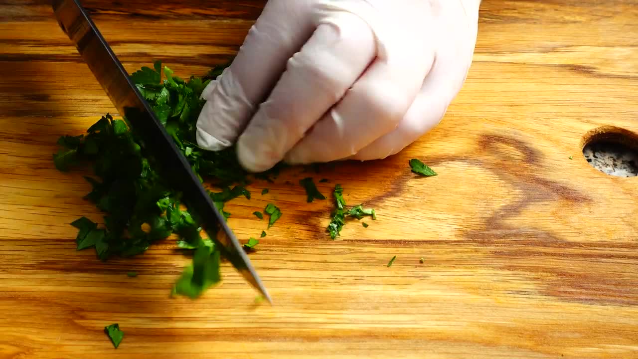 Download Stock Video Person In Gloves Cutting Parsley Live Wallpaper