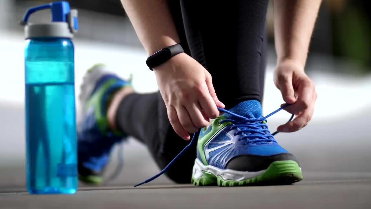 Download Stock Video Person In Sportswear Tying His Shoelaces Live Wallpaper