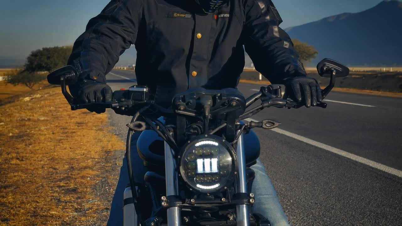 Download Stock Video Person On A Motorcycle Parked On The Side Of A Live Wallpaper