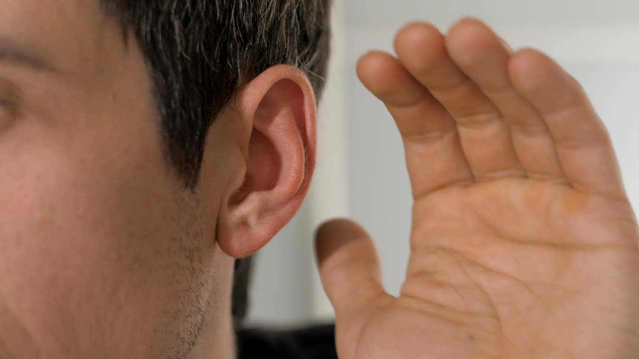 Download Stock Video Person Places His Hand On His Ear To Hear Better Live Wallpaper