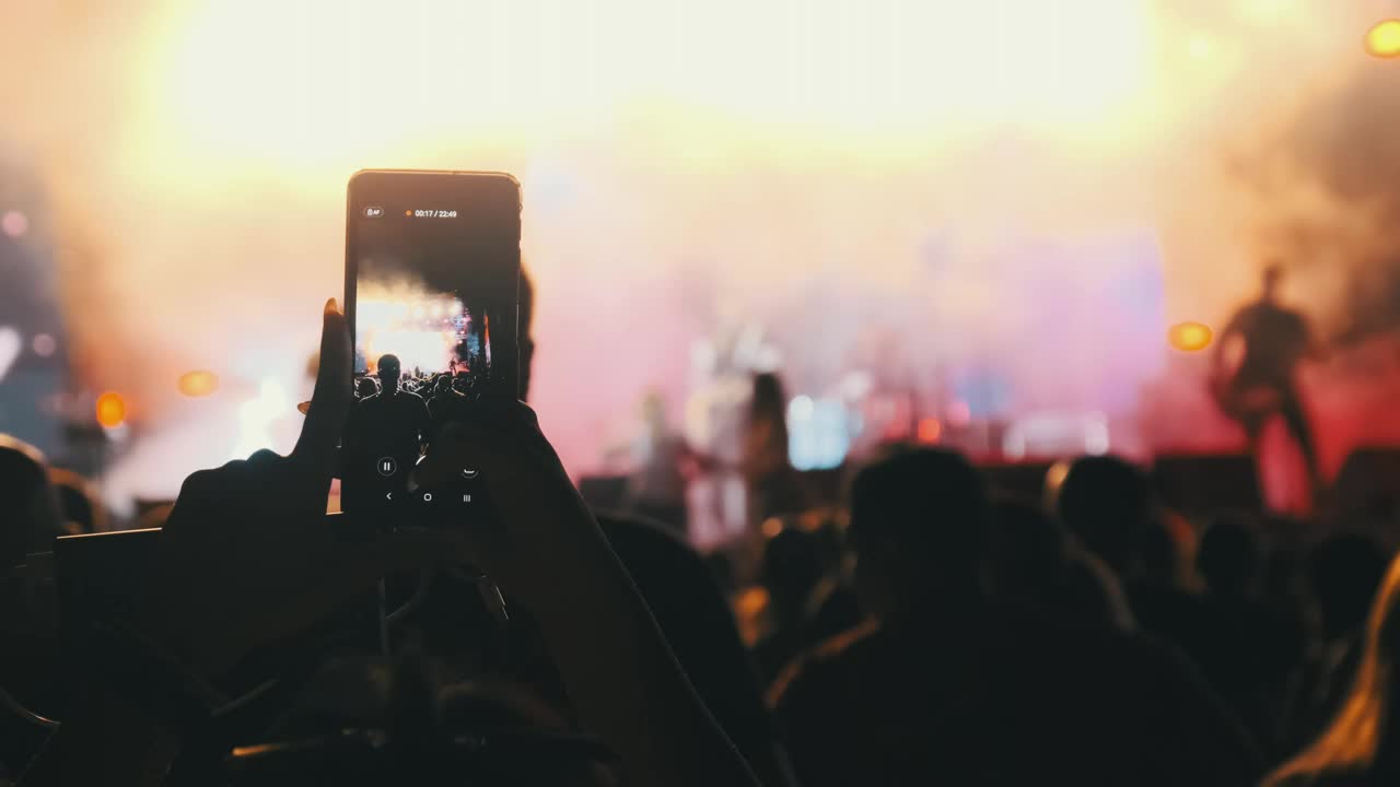 Download Video Stock Person Recording A Concert With His Cell Phone Live Wallpaper Free