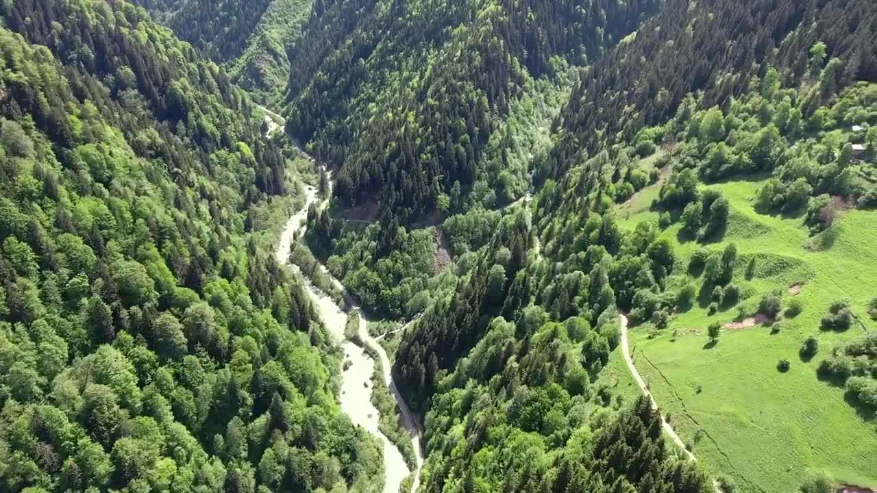 Download Video Stock Pine Mountains With A Small Village In A Meadow Live Wallpaper Free