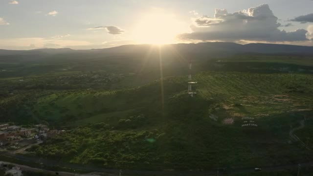 Download Video Stock Plateau In The Middle Of A Large Meadow Aerial Shot Live Wallpaper Free