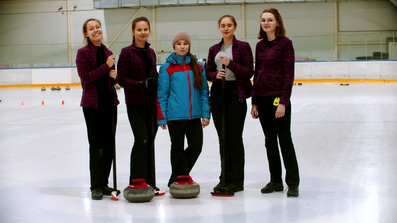 Download Video Stock Portrait Of A Curling Team On An Ice Rink Live Wallpaper Free