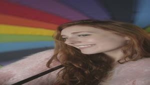 Download Video Stock Portrait Of A Girl Smiling With A Colorful Umbrella Live Wallpaper Free