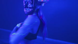 Download Video Stock Portrait Of A Girl With A Neon Mask Dancing Dynamically Live Wallpaper Free