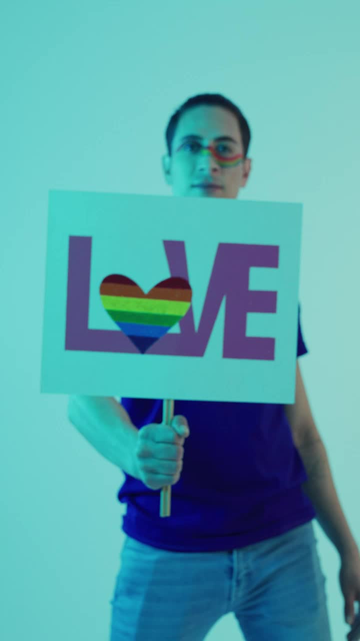 Download Video Stock Portrait Of A Lgbt Man With A Sign With The Live Wallpaper Free