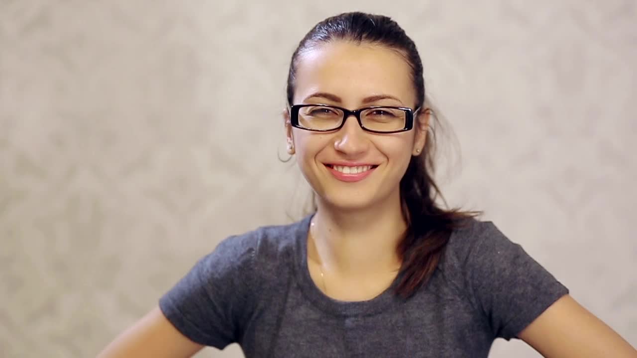 Download Video Stock Portrait Of Woman With Glasses Smiling Live Wallpaper Free