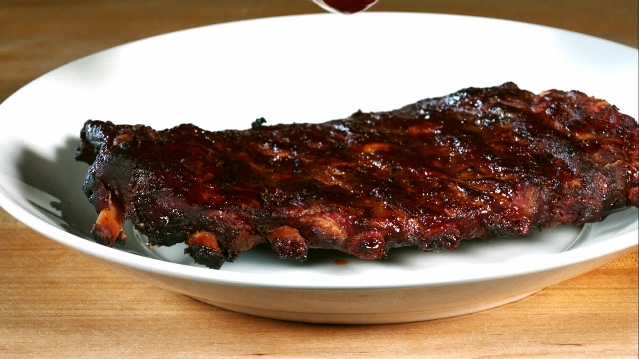 Download Video Stock Pouring Barbecue Sauce On Ribs Live Wallpaper Free