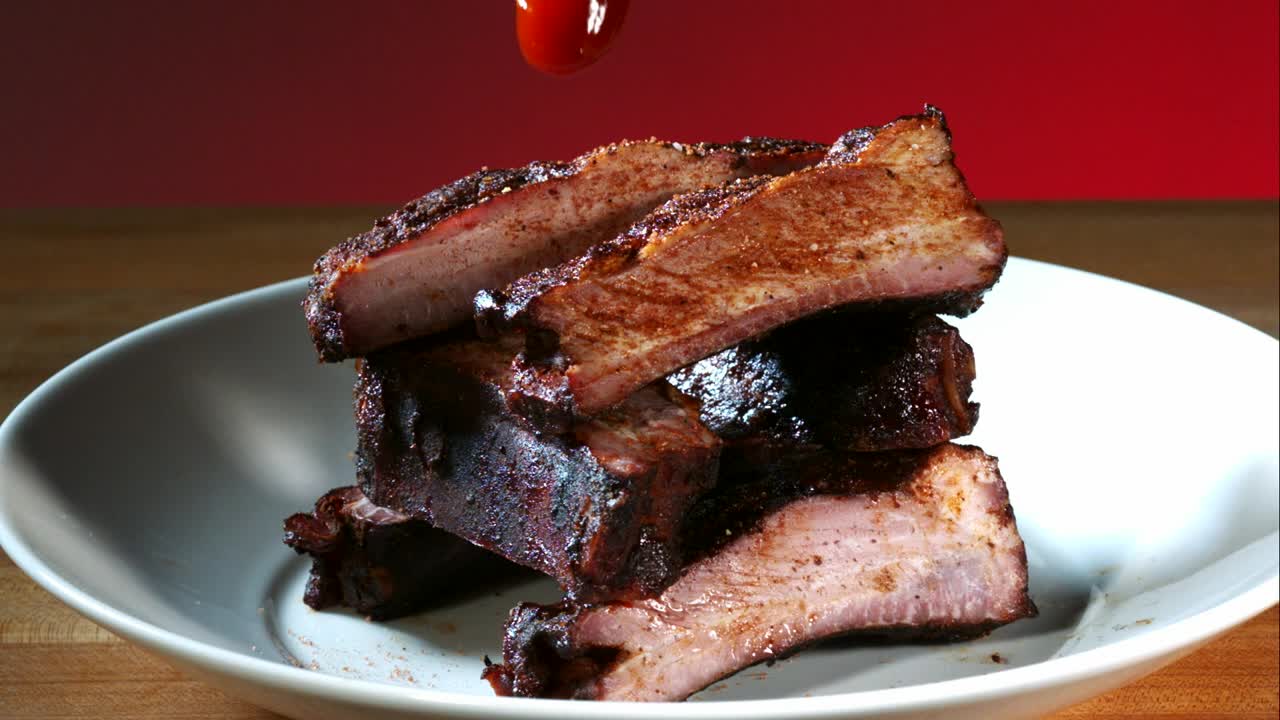 Download Video Stock Pouring Barbecue Sauce To Ribs On The Plate Live Wallpaper Free