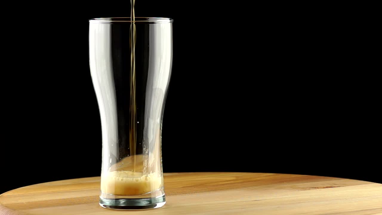 Download Video Stock Pouring Beer On A Glass And Foam Spilling Live Wallpaper Free