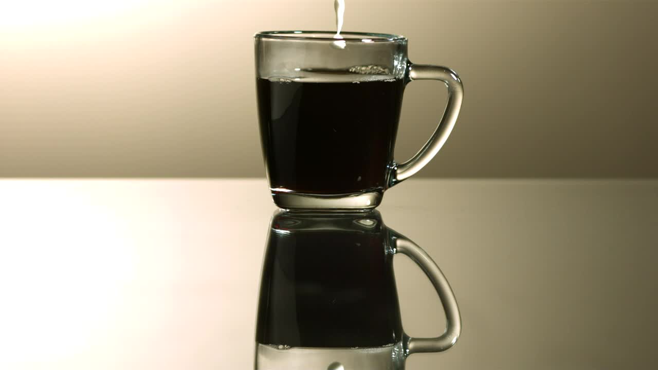 Download Video Stock Pouring Milk Into A Cup Of Coffee In Slow Motion Live Wallpaper Free