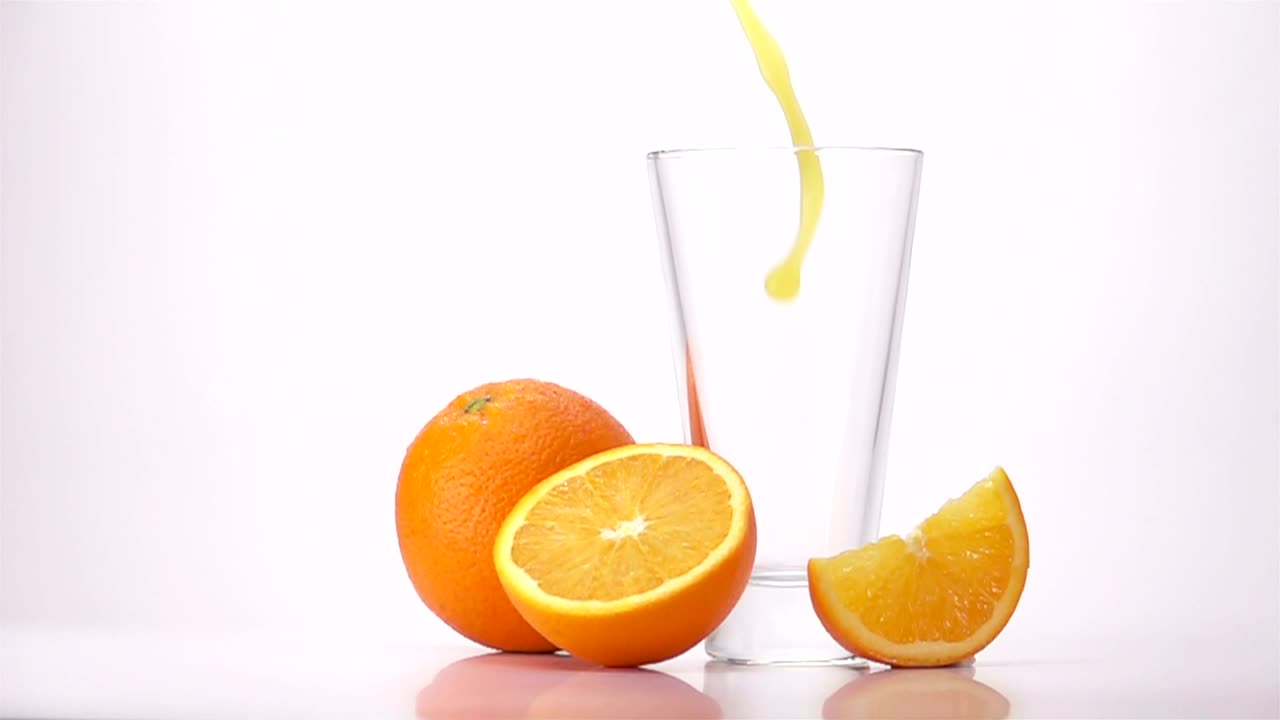 Download Video Stock Pouring Orange Juice Into A Glass Live Wallpaper Free