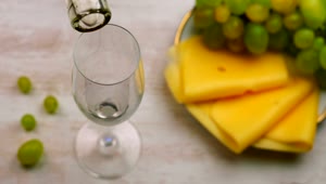 Download Video Stock Pouring White Wine And A Plate Of Cheese Snacks Live Wallpaper Free