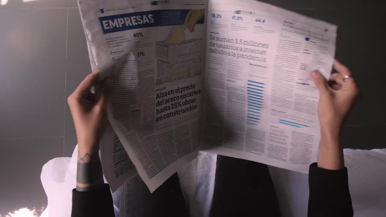 Download Video Stock Pov Flipping Through A Newspaper Live Wallpaper Free