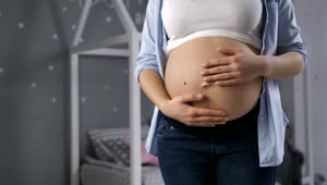 Download Video Stock Pregnant Woman Holding Her Belly Live Wallpaper Free