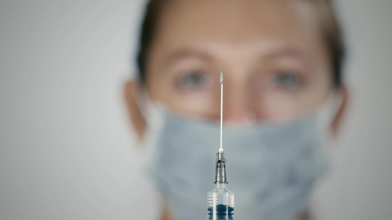 Download Video Stock Preparing A Vaccine Syringe Live Wallpaper Free