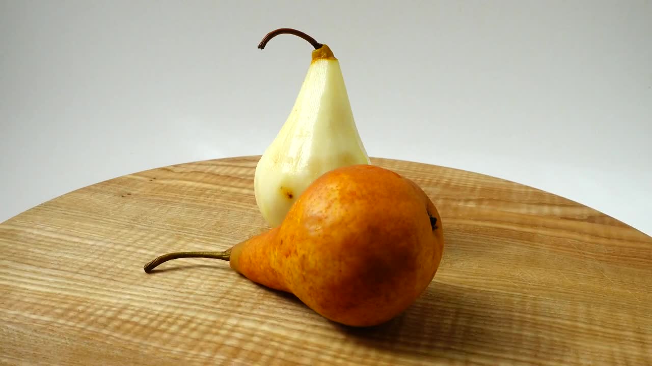 Download Video Stock Presentation Of Pears Rotating On A Table Live Wallpaper Free