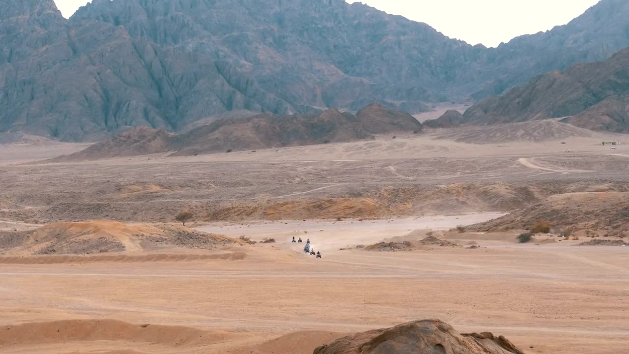 Download Video Stock Quad Bikes Gang Crossing The Desert Live Wallpaper Free