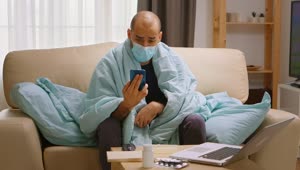Download Video Stock Quarantined Man With Smartphone Video Chats On Sofa Live Wallpaper Free