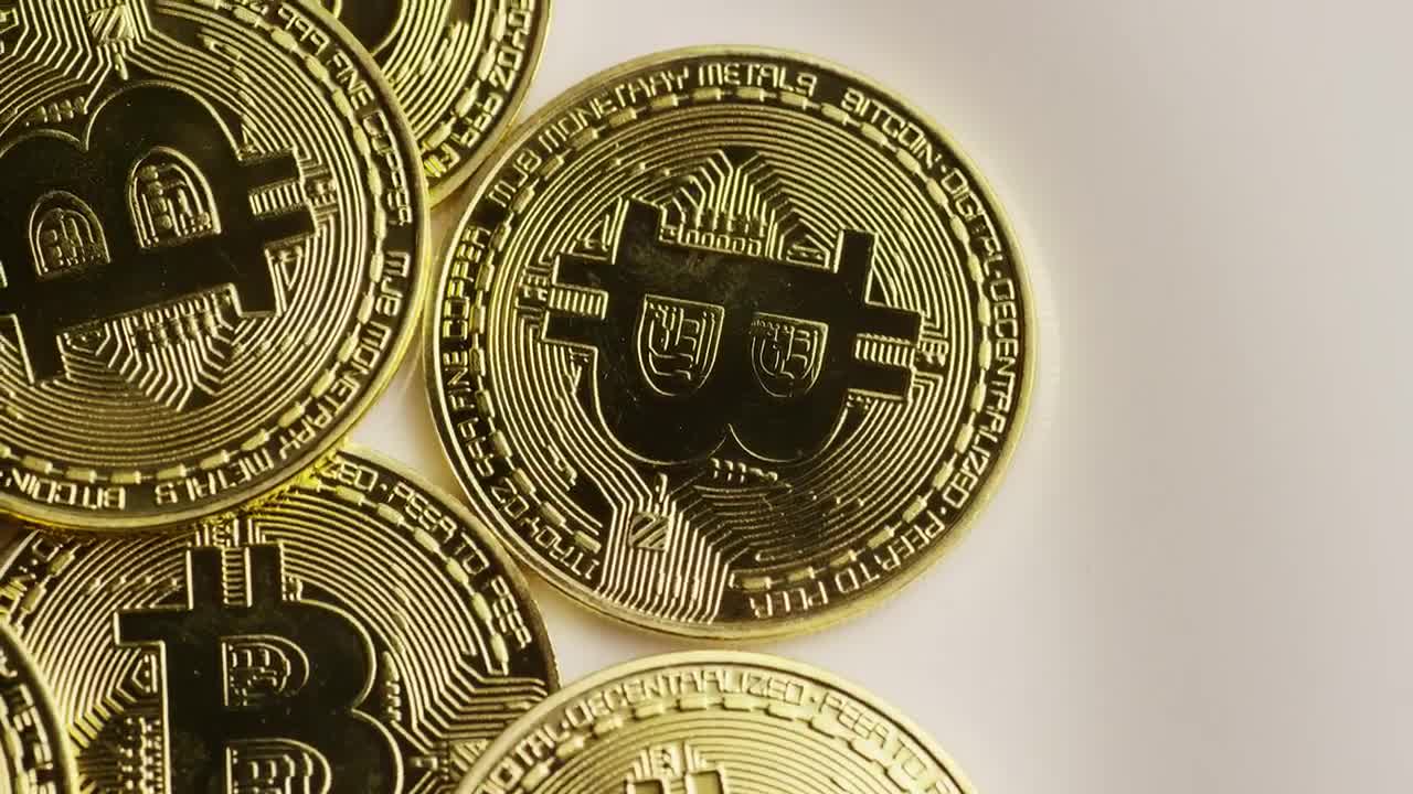 Download Video Stock Real Bitcoin Coins Rotating On A Surface Live Wallpaper Free